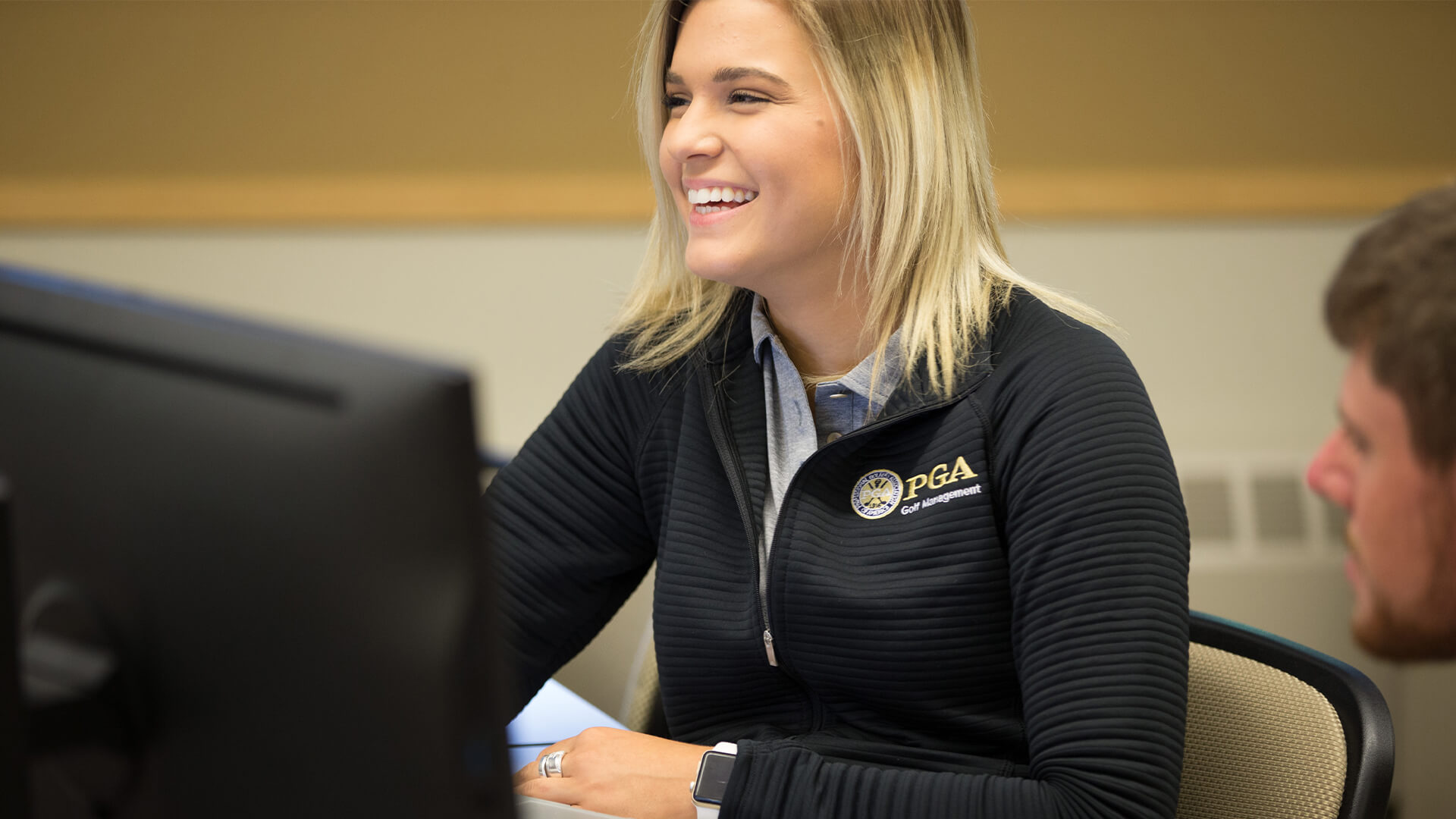 Student laughing in classroom